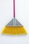 Colorated broom on white background