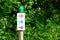 Colored arrow markings for walking and hiking trails pathway in nature forest park woods