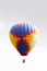 Colored balloon over grey sky