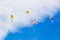 Colored balloons with Bulgarian letters in blue sky