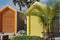 Colored beach huts, wooden cabins.