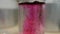 Colored beautiful chemical reaction in flask. Pink or red liquid dissolves in flask. Pink matter in the flask. Pink or