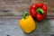 Colored bell peppers on wooden