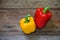 Colored bell peppers on wooden