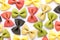 Colored bow tie pasta. Closeup multiple farfalle