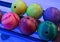 Colored bowling ball yellow pink lie in a line