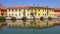 Colored buildings with reflections in the water in italy