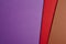 Colored carboards background in purple, red, brown tone. Copy sp