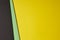 Colored cardboards background in black green yellow tone. Copy s