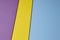 Colored cardboards background in blue yellow purple tone. Copy s