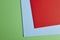 Colored cardboards background in green, blue, red tone. Copy spac