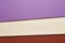 Colored cardboards background in purple beige red tone. Copy spa