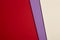 Colored cardboards background in red, purple, beige tone. Copy s