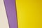 Colored cardboards background in yellow purple beige tone. Copy