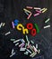 Colored chalks numbers and letters on blackboard