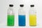 Colored chemicals, glass bottles on a white background