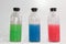 Colored chemicals, glass bottles on a white background