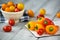 Colored cherry tomatoes and mini paprika on a wooden table