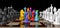 Colored chess. Colored chess in rainbow colors or LGBT communities stand on a chessboard between rows of white and black pieces