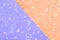 Colored confetti scattered on Colored confetti scattered on purple pastel paperand yellow pastel paper
