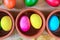 Colored decorated Easter eggs in clay bowls