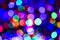 Colored defocused lights background. Abstract bokeh lights