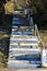 Colored, dilapidated steps with white fence