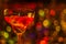 Colored drink in glass, cocktail, night lights bokeh background