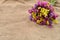 Colored dry bouquet on rustic jute background. Beautiful arrange