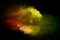 Colored dust splash cloud on dark background. Launched colorful particles on background