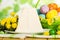 Colored Easter eggs in basket, traditional cheesecake dessert, h