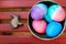 Colored easter eggs in a ceramic bowl