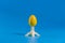 .Colored easter plastic egg on a stand in the form of a rocket