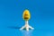 .Colored easter plastic egg on a stand in the form of a rocket