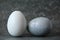 Colored eggs. Beautiful eggs. Eggs on a dark background