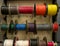 Colored electrical wires on spools on rack