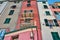 Colored facade of houses on the seafront of Porto Venere in Italy bottom view in perspective