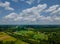 Colored fields from height in the summer in the flight of the drone over the meadows