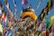 colored flags hanging from the top of the stupa Bodnath, Kathmandu