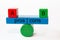 Colored fragments in fragile balance with the words pros | cons. On top of the seesaw are a red block with A and a green Block wit