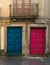 Colored front doors, old facade of building.