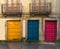 Colored front doors, old facade of building.