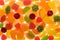 Colored fruit marmalade. Lemon, apple, orange, grapefruit. Jelly colour background