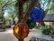 Colored glass balls hanging with a hemp net, very basic and simple decoration but effective.