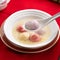Colored glaze style big tangyuan with sweet rice wine soup and egg drop