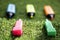 Colored highlighters lined up on top of the lawn