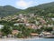 Colored houses on hill with abundant vegetation.  Martinique in French West Indies. Antilles. Caribbean landscape