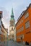 The colored houses of Kreuzstrasse and clock tower of Kreuzkirche Holy Cross Church, Hanover, Germany