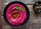 Colored hummus, classic hummus, beet hummus, hummus on a dark rustic background. Top view, flat lay. Clean eating, dieting, vegeta