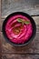 Colored hummus, classic hummus, beet hummus, hummus on a dark rustic background. Top view, flat lay. Clean eating, dieting, vegeta